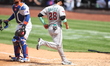 Arizona Diamondbacks' Eugenio Suarez #28 scores on an error during the fourth inning of th...