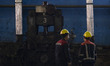 Iranian workers work at the Kerman steel and rolling complex in Khazra industrial city in...