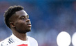 Bukayo Saka of Arsenal warms up before the UEFA Champions League Semi-final Second Leg foo...