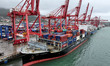 A cargo ship moors at the container terminal berth of Lianyungang Port for loading and unl...