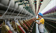 A worker works in a workshop of a textile products manufacturing enterprise in Qingzhou Ec...