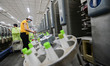 A worker works in a workshop of a textile products manufacturing enterprise in Qingzhou Ec...