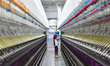 A worker works in a workshop of a textile products manufacturing enterprise in Qingzhou Ec...