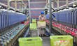 A worker works in a workshop of a textile products manufacturing enterprise in Qingzhou Ec...