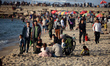 Palestinians spend time on the Mediterranean Sea beach during the hot weather in Gaza City...