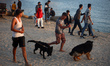 Palestinians spend time on the Mediterranean Sea beach during the hot weather in Gaza City...