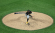 Pittsburgh Pirates starting pitcher Paul Skenes #30 throws during the fourth inning of a b...