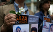 A woman holds flowers. A commemoration of the 1948 'Nakba' (catastrophe) and a gathering a...