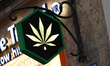 A marijuana symbol on a store sign is seen on the street in Krakow, Poland, on May 14, 202...