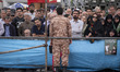 An Iranian Islamic Revolutionary Guard Corps (IRGC) military personnel monitors an area wh...