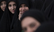 Iranian schoolgirls participate in a ceremony commemorating the late Iranian President Ebr...