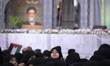 An Iranian schoolgirl looks on while participating in a ceremony commemorating the late Ir...