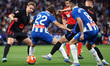 Carlos Romero and Frenkie de Jong play during the match between RCD Espanyol and FC Barcel...
