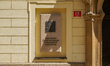 The plaque of the Chamber of Deputies of the Parliament of the Czech Republic is at the en...