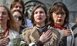 Members of the Lehit folk band and Robymo Vam Nervy NGO wear traditional Ukrainian embroid...