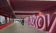 People walk through the pedestrian underpass leading to the Zizkov district, part of the e...