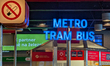 A public transport information point shows directions for metro, tram, and bus services at...