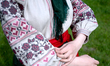 A woman wears a vyshyvanka (Ukrainian embroidered shirt) of the Donetsk region at the Nati...