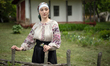 A woman wears a vyshyvanka (Ukrainian embroidered shirt) of the Donetsk region at the Nati...