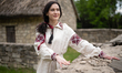 A woman wears a vyshyvanka (Ukrainian embroidered shirt) of the Kherson region at the Nati...