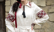 A woman wears a vyshyvanka (Ukrainian embroidered shirt) of the Kherson region at the Nati...