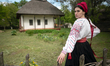 A woman wears a vyshyvanka (Ukrainian embroidered shirt) of the Luhansk region at the Nati...