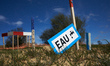 A sign reads 'Water' at the A69 construction site. The Administrative Court of Toulouse su...
