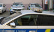 Police patrol vehicles park in front of a local police station in the historic center of P...