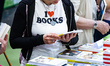 A woman with a t-shirt reading 'I love books' visits the Salone del Libro (Book Fair) 2025...