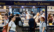 People visit the stand of the editorial group Sellerio from Palermo at the Salone del Libr...