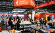 People visit the stand of the editorial group Feltrinelli at the Salone del Libro (Book Fa...
