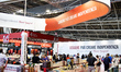 People visit the stand of the editorial group of Mauri Spagnol Garzanti with a slogan read...