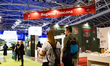 People walk past the Region Tuscany at the Salone del Libro (Book Fair) 2025 in Turin, Ita...