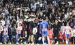 FC Barcelona players celebrate the La Liga championship while Pere Milla of RCD Espanyol c...