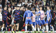FC Barcelona players celebrate the La Liga championship while Pere Milla of RCD Espanyol c...