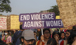 Activists take part in a rally against the surge in gender-based violence and demand equal...