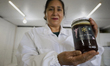 Martha Flores Garcia, a beekeeper, displays products made with honey from bees grown betwe...