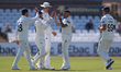 Codi Yusuf of Durham celebrates with his teammates after taking the wicket of Nottinghamsh...