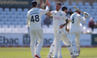 Codi Yusuf of Durham celebrates with his teammates after claiming the wicket of Nottingham...