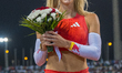 Molly Caudery of Britain celebrates after winning the women's Pole Vault final at the Diam...