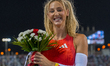 Molly Caudery of Britain celebrates after winning the women's Pole Vault final at the Diam...