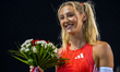 Molly Caudery of Britain celebrates after winning the women's Pole Vault final at the Diam...