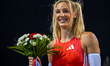 Molly Caudery of Britain celebrates after winning the women's Pole Vault final at the Diam...