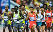 Wale Getnet of Ethiopia and Lobalu Dominic Lokinyomo of Switzerland compete in the men's 5...