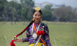 A female member of Nepal's indigenous Kirat community poses for a photo as she attends a m...