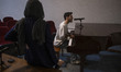 A young Iranian musician plays the piano before the beginning of a film screening and work...