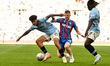 Nico OReilly (75 Manchester City) is challenged by Adam Wharton (20 Crystal Palace) during...