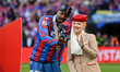 Jean Philippe Mateta of Crystal Palace stands with one of the female Emirates girls during...