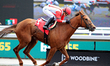 Jockey Sofia Vives takes Magic Modie across the finish line for a win in the third race at...