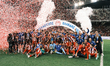 Olympiacos players and team personnel celebrate with the trophy following the Greek Cup Fi...